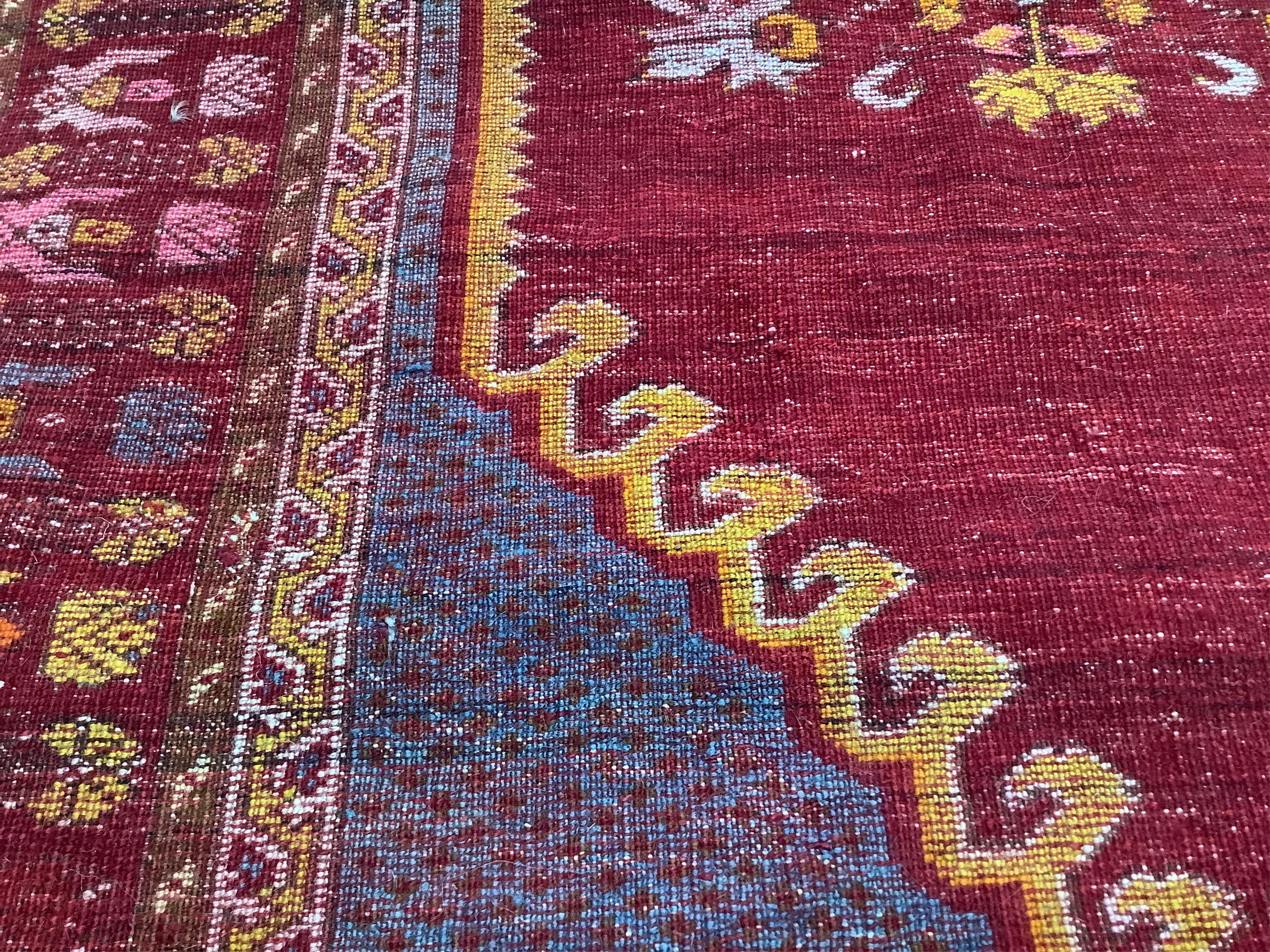 An antique hand knotted Caucasian blue ground prayer rug, 180 x 117cm